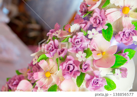 wedding cake decoration. beautiful wedding cake with purple orchids. cake in violet tones wedding cake decoration. beautiful wedding cake with purple orchids. cake in violet tones 138856577