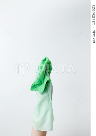 Green cleaning products, the woman cleans using rubber gloves and a microfiber cloth. Household cleaning and hygiene concept 138856625