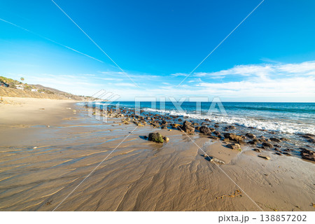 Beach in Malibu under a blue sky Beach in Malibu under a blue sky 138857202
