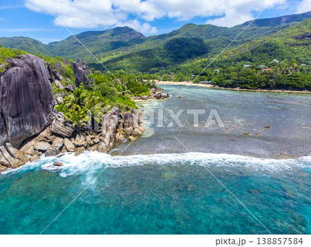Granite rocks and coral reef in a tropical island 138857584