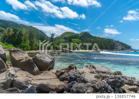 Rocks and turquoise water in an empty tropical beach Rocks and turquoise water in an empty tropical beach 138857746