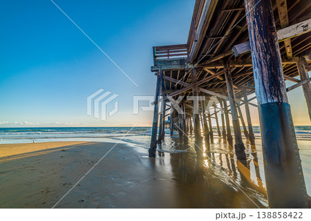 Newport Beach pier at sunset seen from below Newport Beach pier at sunset seen from below 138858422