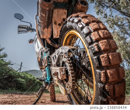Dirty adventure motorcycle seen from the ground 138858434