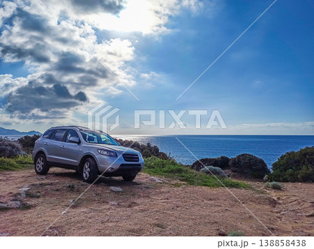 4x4 car  parked on rough terrain by the sea 138858438