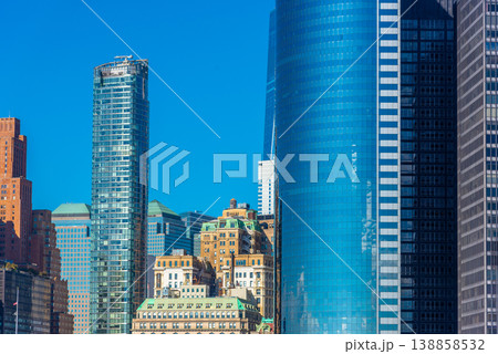 Modern and ancient buildings in Lower Manhattan on a sunny day Modern and ancient buildings in Lower Manhattan on a sunny day 138858532