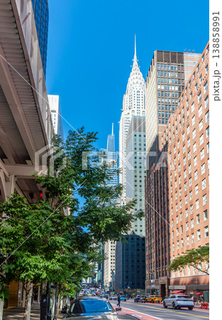 Skyscrapers in Midtown Manhattan under a blue sky Skyscrapers in Midtown Manhattan under a blue sky 138858991