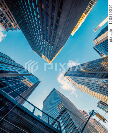 Skyscrapers in Midtown Manhattan under a blue sky Skyscrapers in Midtown Manhattan under a blue sky 138859014