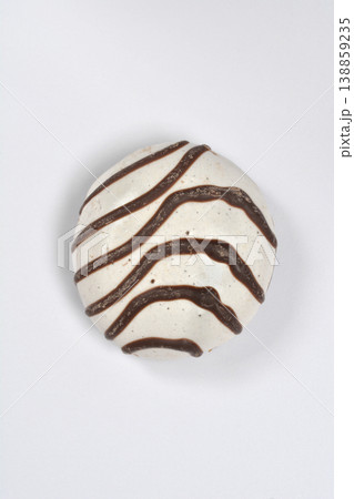 Round cookie with chocolate stripes Round cookie with chocolate stripes 138859235