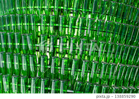 Background of empty green glass bottles. Recycling and reuse of glass bottles . Background of empty green glass bottles. Recycling and reuse of glass bottles . 138859290