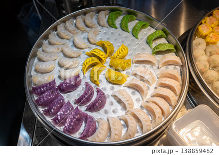 Colorful Assortment of Dumplings in a Steamer at an Asian Night Food Street Market in China 138859482