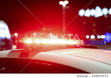 Close up view of flashing police car siren lights at night. Blue and red police lights 138859572