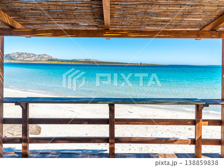 La Pelosa Beach view from a wooden veranda with Isola Piana in the background Sardinia 138859838