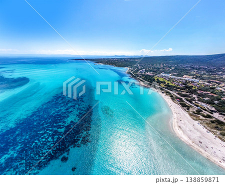 Sunny Aerial View of La Pelosa Beach with Turquoise Water in Sardinia Sunny Aerial View of La Pelosa Beach with Turquoise Water in Sardinia 138859871