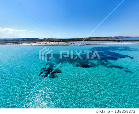 Distant Aerial View of Turquoise Mediterranean Sea Under Clear Blue Sky in Sardinia 138859872