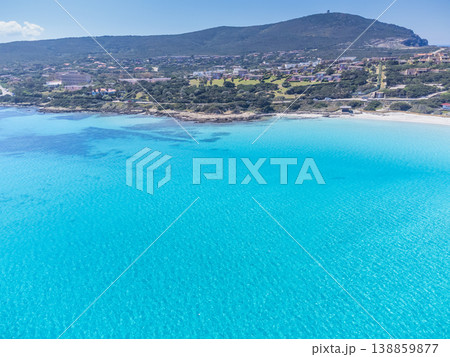 Aerial View of La Pelosa Beach from the Sea Toward the Coastline with Turquoise Water and White Sand 138859877