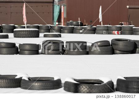 Racetrack fence . Old tires on a kart racing track . Racetrack fence . Old tires on a kart racing track . 138860017
