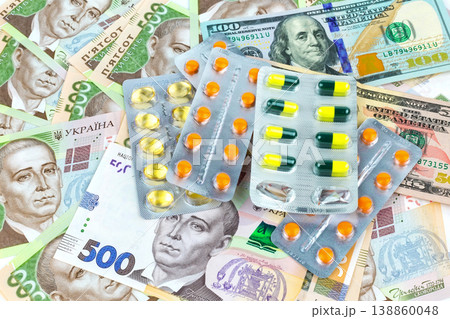 Money and pills: a symbol of the rising cost of medicines in the world and in Ukraine. 138860048