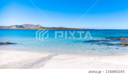 White sand beach with turquoise water and rocks 138860165