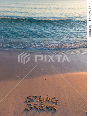 Spring Break written on the foreshore at sunset 138860171