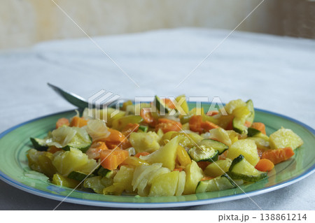 Healthy sauteed vegetables on a green plate 138861214