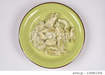 Green Gnocchi in Creamy Sauce on a Plate Green Gnocchi in Creamy Sauce on a Plate 138861369