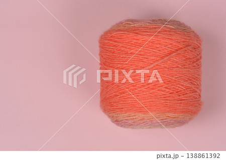 Pink Wool Ball on Pastel Background Pink Wool Ball on Pastel Background 138861392