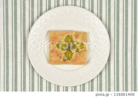 Focaccia Slice with Leek Flower and Salted Capers Focaccia Slice with Leek Flower and Salted Capers 138861400