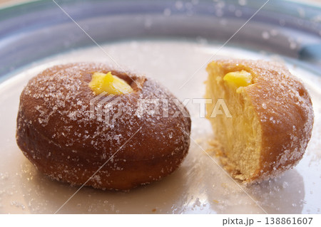 Custard doughnuts with sugar coating on a white plate 138861607