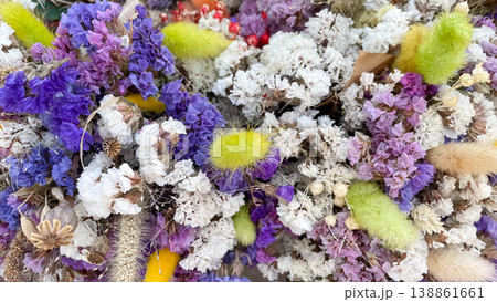 Full frame background of colorful dried Limonium flowers and Lagurus grass in a rustic floral pattern Full frame background of colorful dried Limonium flowers and Lagurus grass in a rustic floral pattern 138861661