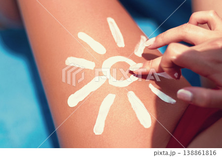 Closeup  female  leg with sun shape. Sun protection sun cream, on her smooth tanned legs. Sunblock. Skincare. 138861816