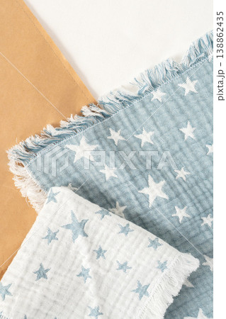 Soft cotton cloth with star patterns on table with craft paper and fabric 138862435