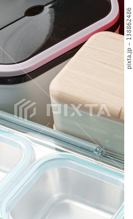 Lunch box organizer shows different containers for meals and snacks on a kitchen counter 138862486