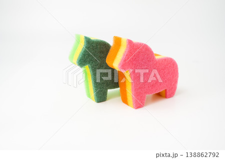 large multi-colored sponge for washing dishes in the form of a horse isolated large multi-colored sponge for washing dishes in the form of a horse isolated 138862792