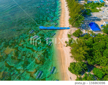 The beautiful aerial view of the morning on the beach with blue sea water in Kaur, Bengkulu, Indonesia The beautiful aerial view of the morning on the beach with blue sea water in Kaur, Bengkulu, Indonesia 138863096