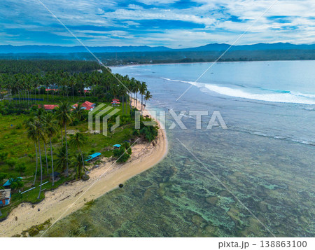 The beautiful aerial view of the morning on the beach with blue sea water in Kaur, Bengkulu, Indonesia The beautiful aerial view of the morning on the beach with blue sea water in Kaur, Bengkulu, Indonesia 138863100
