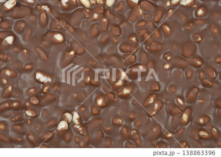 Milk chocolate bar with puffed rice texture background 138863396