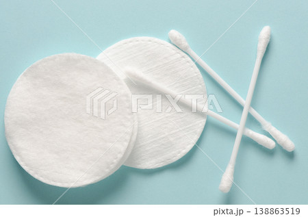 Cotton swabs and cotton pads for hygiene. Blue background. 138863519