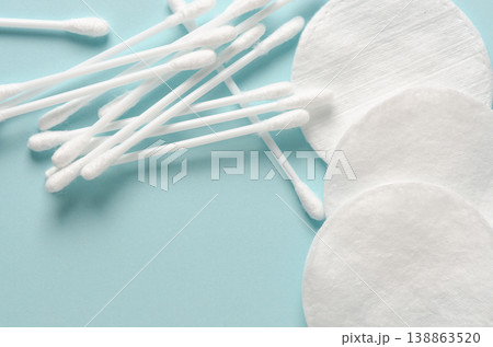 Cotton swabs and cotton pads for hygiene. Blue background. Copy space Cotton swabs and cotton pads for hygiene. Blue background. Copy space 138863520