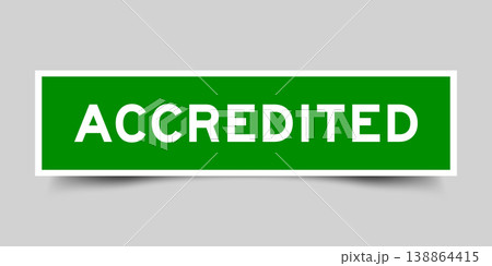 Green color square shape sticker label with word accredited on gray background 138864415