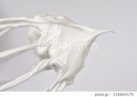 Meringue on a metal whisk Meringue on a metal whisk 138864570