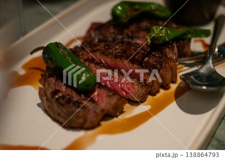 Medium rare wagyu meat served on plate with sauce and vegetable 138864793