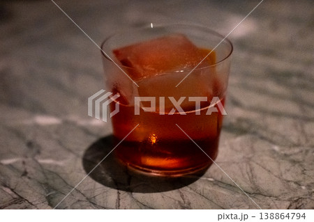 Close up view of orange cocktail on the table with bokeh background 138864794