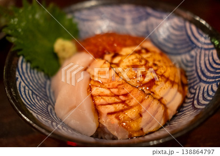 A Japanese rice bowl dish or Don, including Hotate, Aburi Salmon, Ikura. A Japanese rice bowl dish or Don, including Hotate, Aburi Salmon, Ikura. 138864797