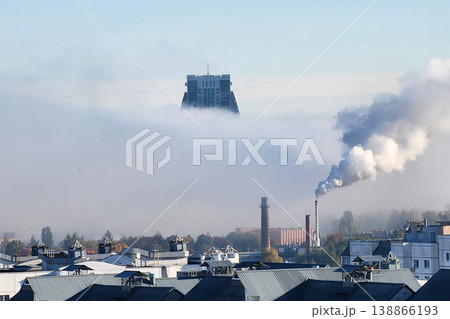 City skyline buildings emerging from dense morning fog City skyline buildings emerging from dense morning fog 138866193