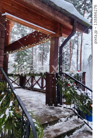 Wooden building decorated for winter holidays with snow Wooden building decorated for winter holidays with snow 138866276