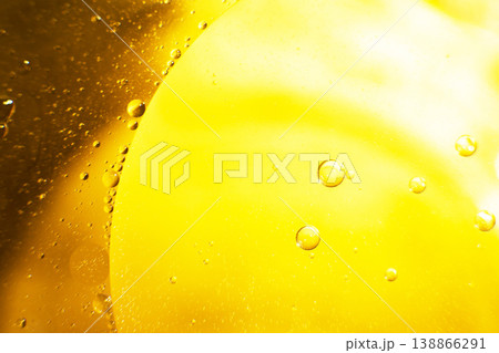 Gold Oil bubbles. circles of orange water macro. abstract yellow background Gold Oil bubbles. circles of orange water macro. abstract yellow background 138866291