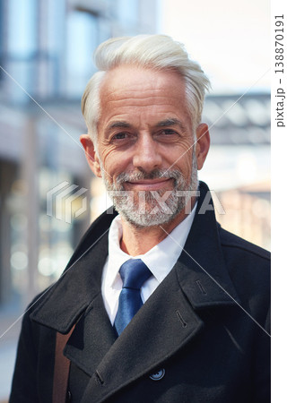 Happy, portrait and mature businessman in the city for travel, commute and morning walk to work. Smile, fashion and elderly corporate employee smiling with confidence, pride and handsome in Norway Happy, portrait and mature businessman in the city for travel, commute and morning walk to work. Smile, fashion and elderly corporate employee smiling with confidence, pride and handsome in Norway 138870191