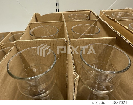 Glass vases in cardboard packaging displayed in a store aisle as potential purchase items Glass vases in cardboard packaging displayed in a store aisle as potential purchase items 138870213