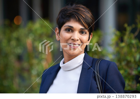 Portrait, smile and business woman in city with vision, mission and success mindset in urban town outdoors. Ceo, boss face and proud, confident and happy female entrepreneur from India ready for work 138870293