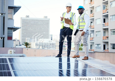 Solar panels, rooftop and engineering people in energy saving, urban sustainability and city installation teamwork. Inspection, checklist and technician men planning sustainable power solution Solar panels, rooftop and engineering people in energy saving, urban sustainability and city installation teamwork. Inspection, checklist and technician men planning sustainable power solution 138870378